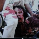 صورة مقتل معمر القذافي وهو جريح كما نشرتها فرانس بريس